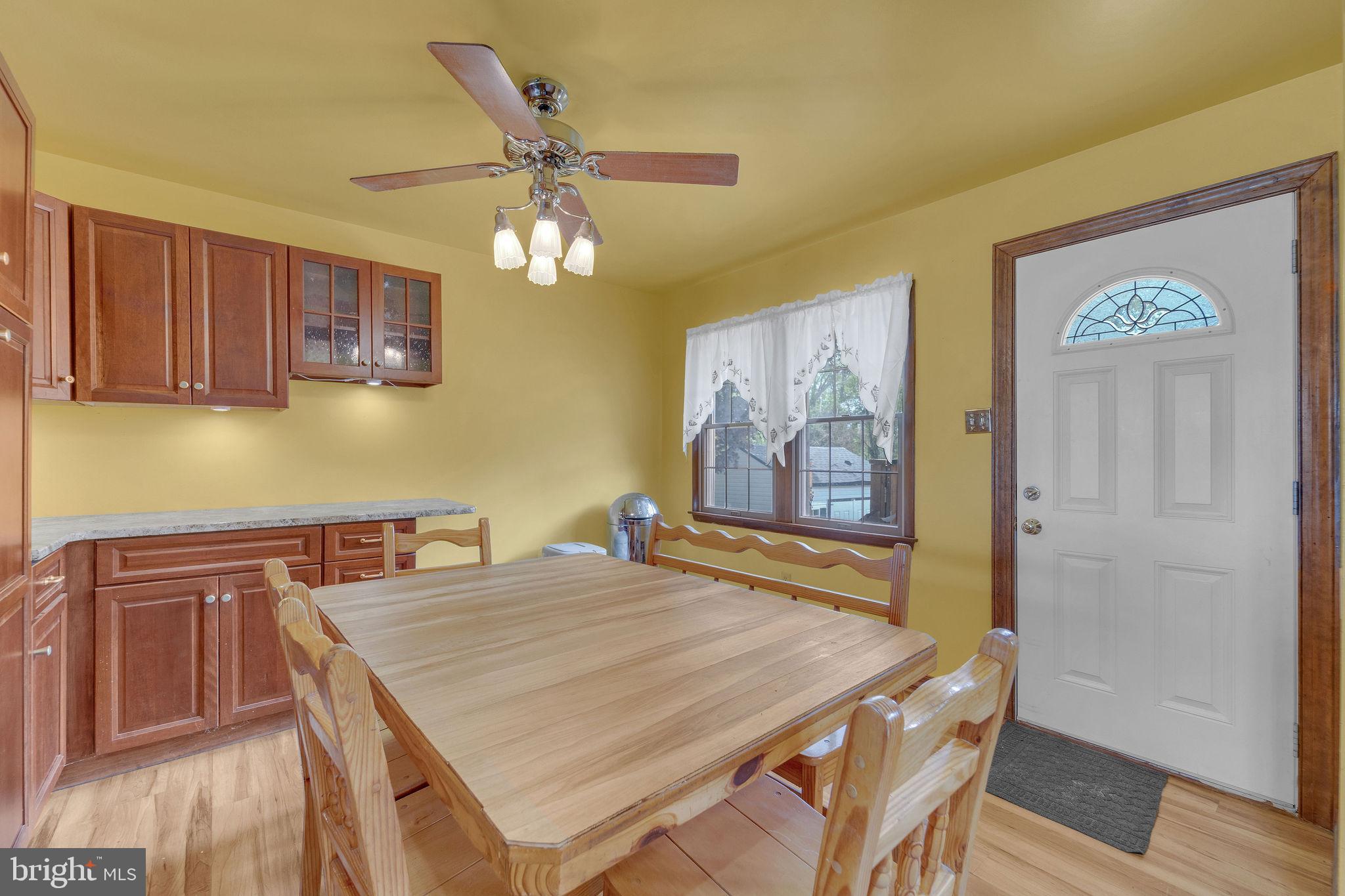 60 Waterford-Blue Anchor Road Hammonton, NJ 08037 - Photo 13 of 30 a dining room with stainless steel appliances wooden floor dining table and chairs