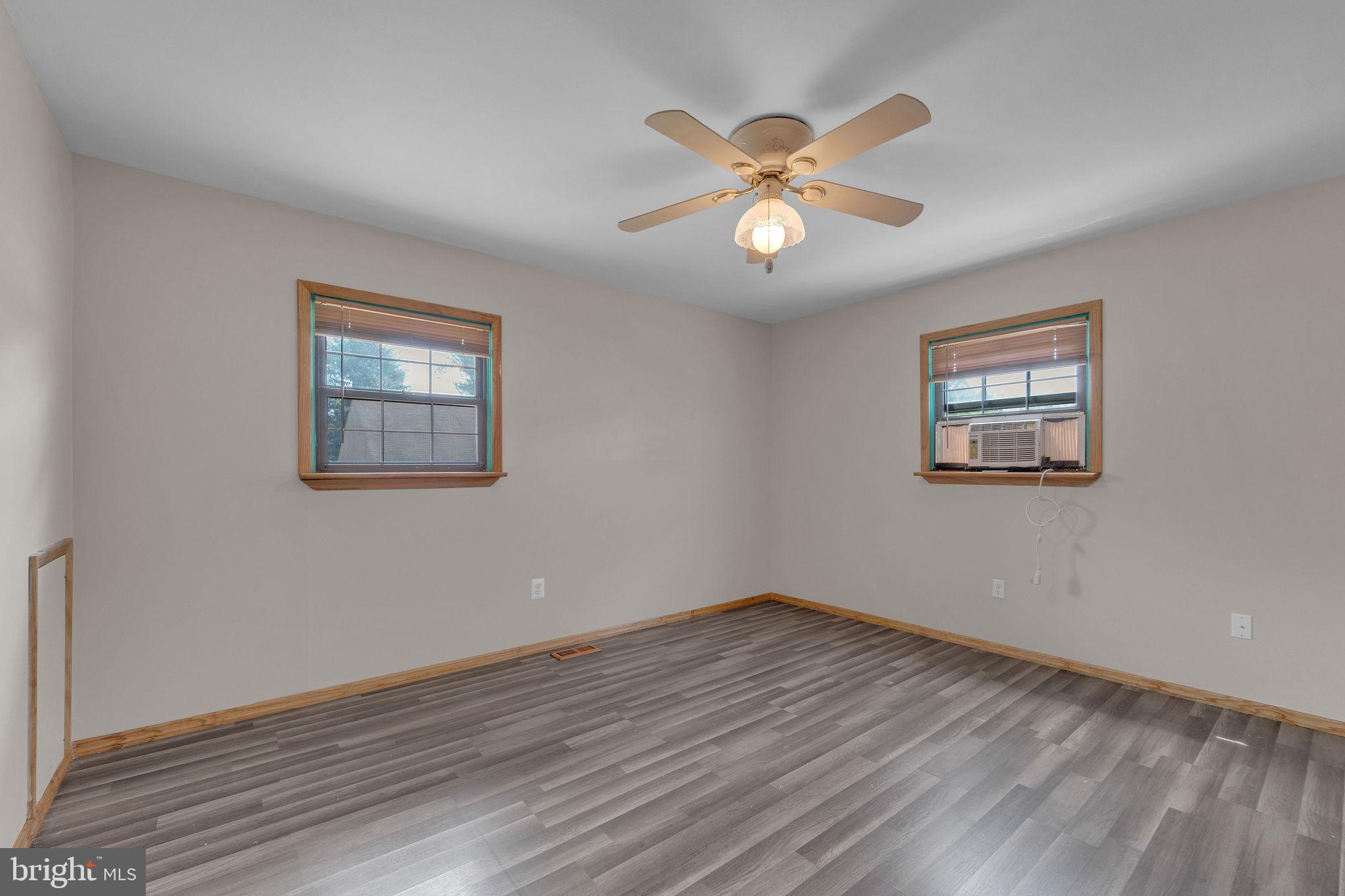 60 Waterford-Blue Anchor Road Hammonton, NJ 08037 - Photo 17 of 30 a view of an empty room with wooden floor and a ceiling fan