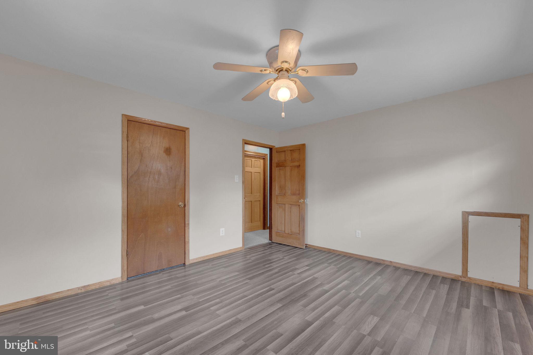 60 Waterford-Blue Anchor Road Hammonton, NJ 08037 - Photo 18 of 30 a view of an empty room with wooden floor and window