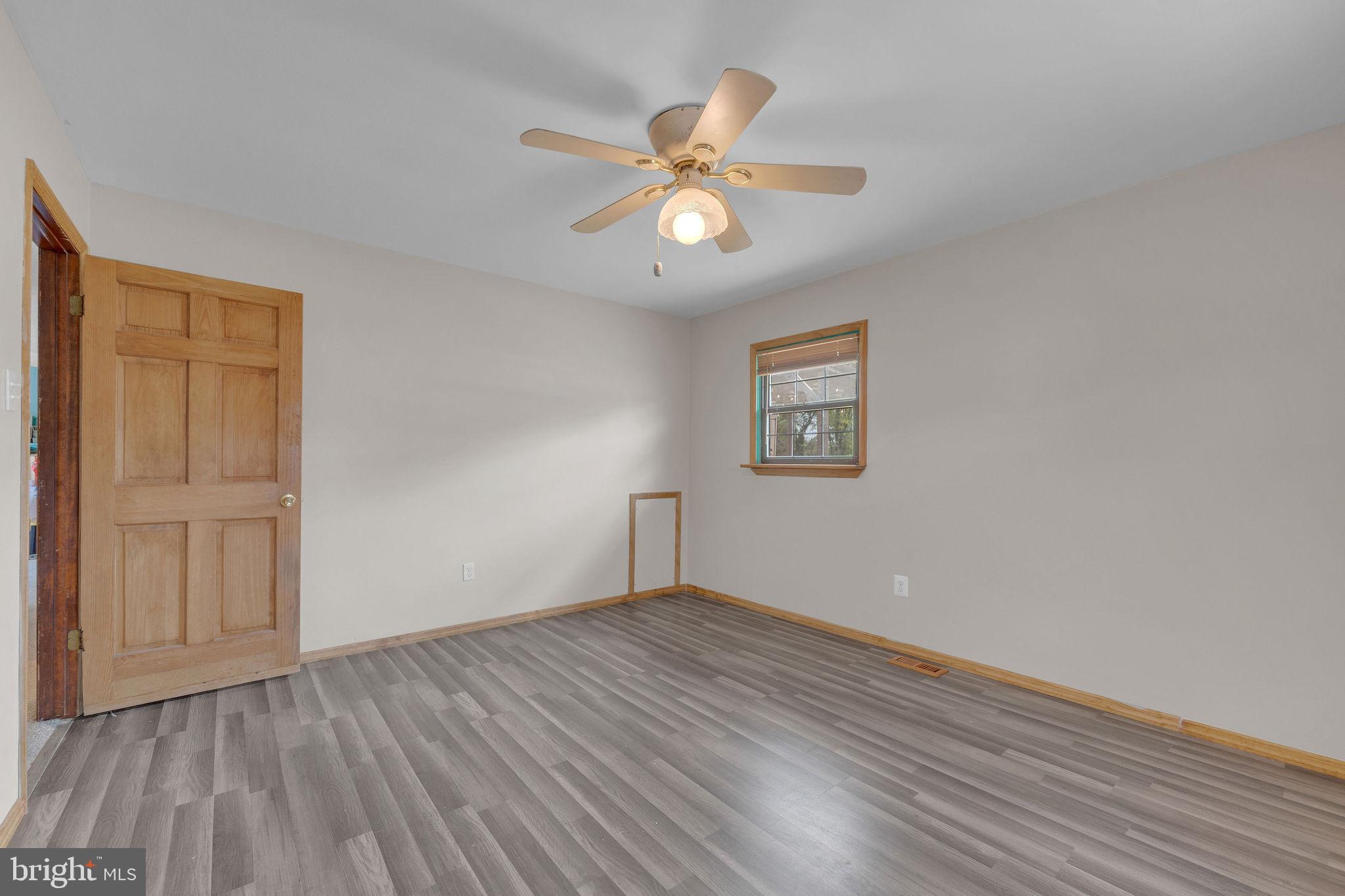 60 Waterford-Blue Anchor Road Hammonton, NJ 08037 - Photo 19 of 30 a view of an empty room with wooden floor and a ceiling fan