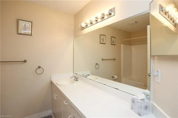 a bathroom with a sink and mirror