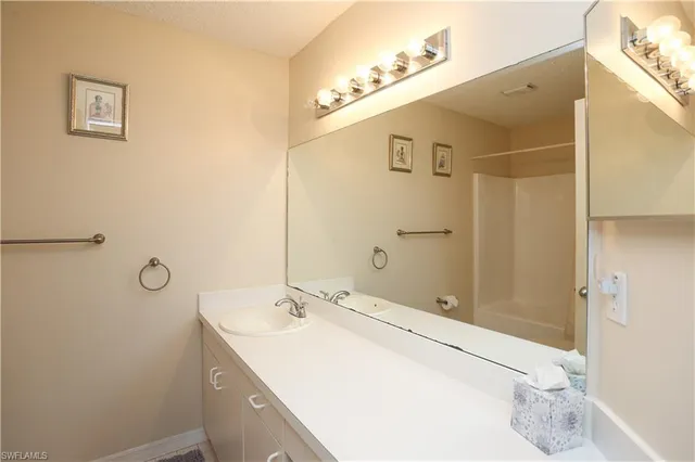 a bathroom with a sink and mirror