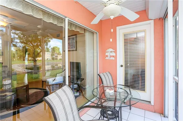 a view of a dining room with furniture window and outside view