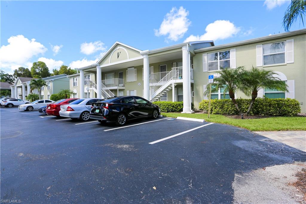 287 Quail Forest Boulevard, Unit 117 Naples, FL 34105 - Photo 18 of 29 a view of a car parked in front of house