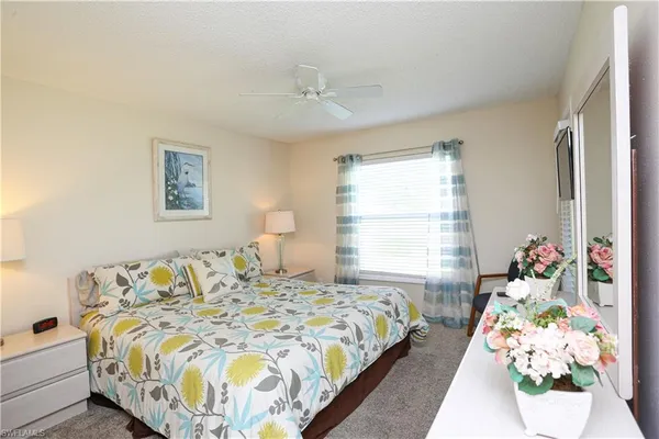 a bedroom with bed and a window