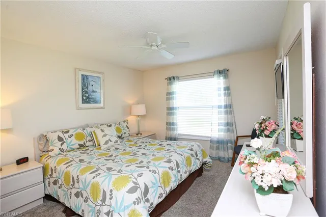 a bedroom with bed and a window