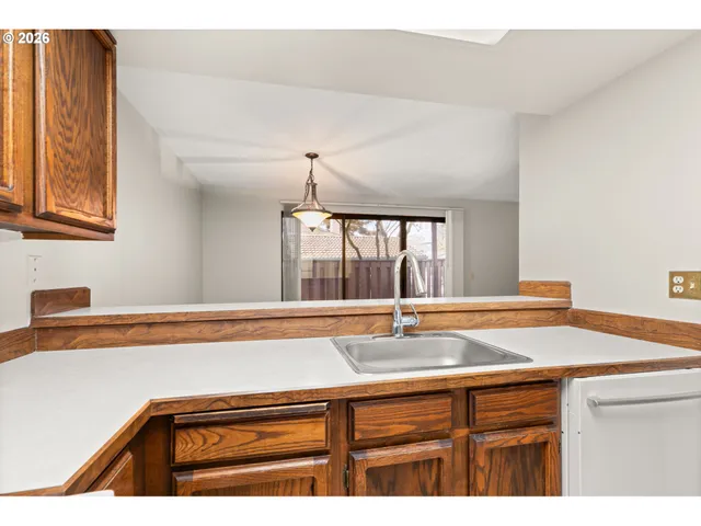 a bathroom with a sink and a window