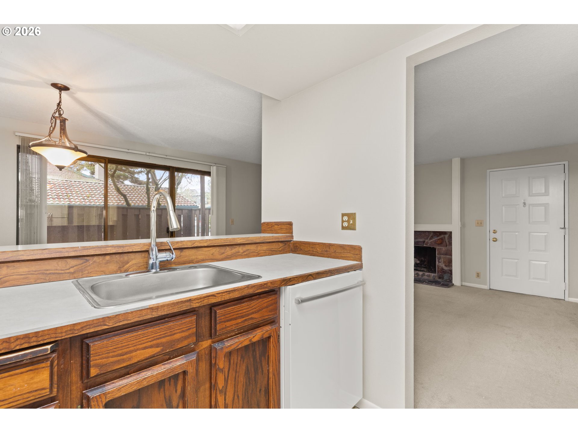 14720 Southwest Grayling Lane Beaverton, OR 97007 - Photo 16 of 32 a view of a kitchen with a sink and large window
