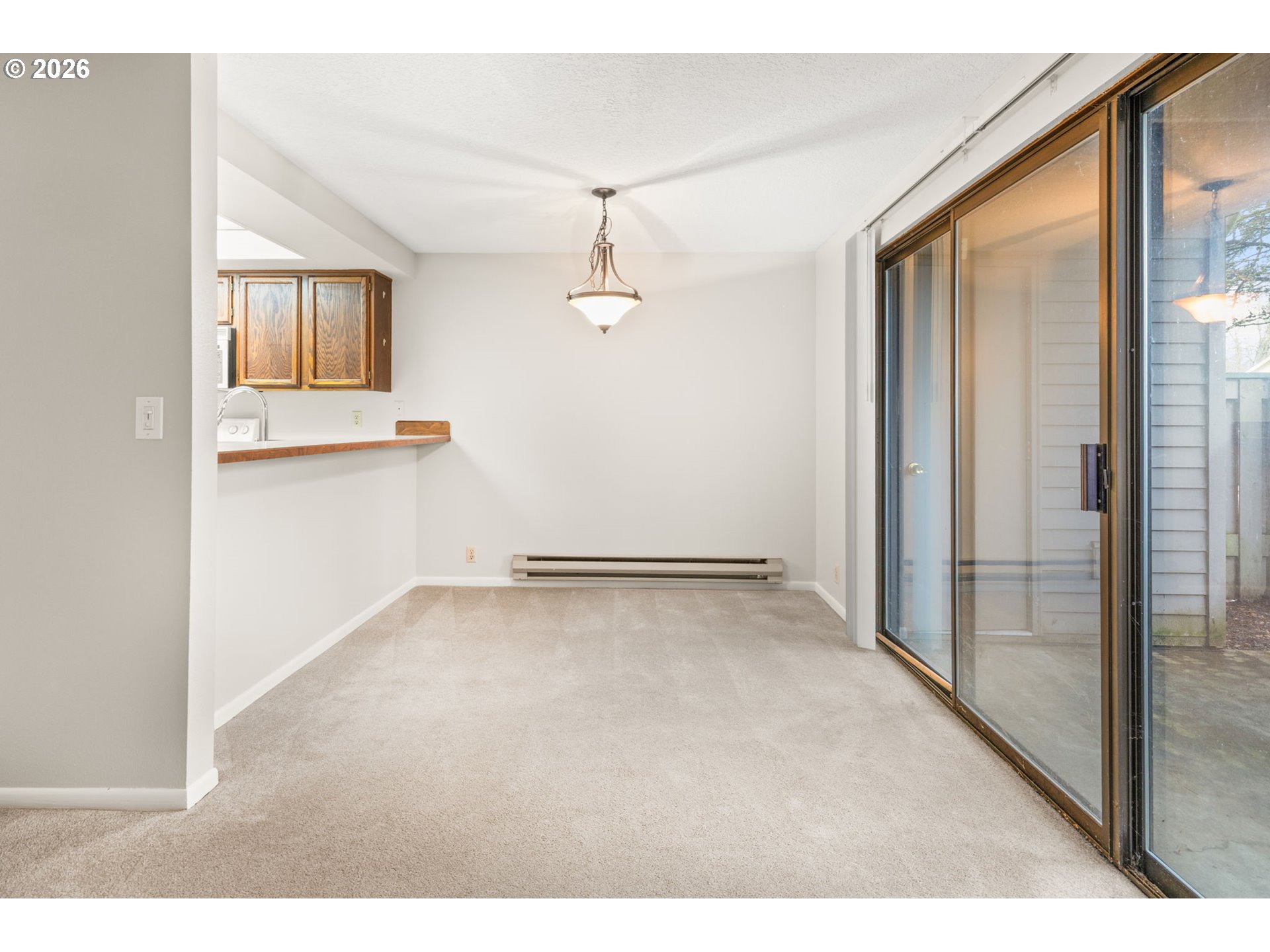 14720 Southwest Grayling Lane Beaverton, OR 97007 - Photo 21 of 32 an empty room with windows and cabinet