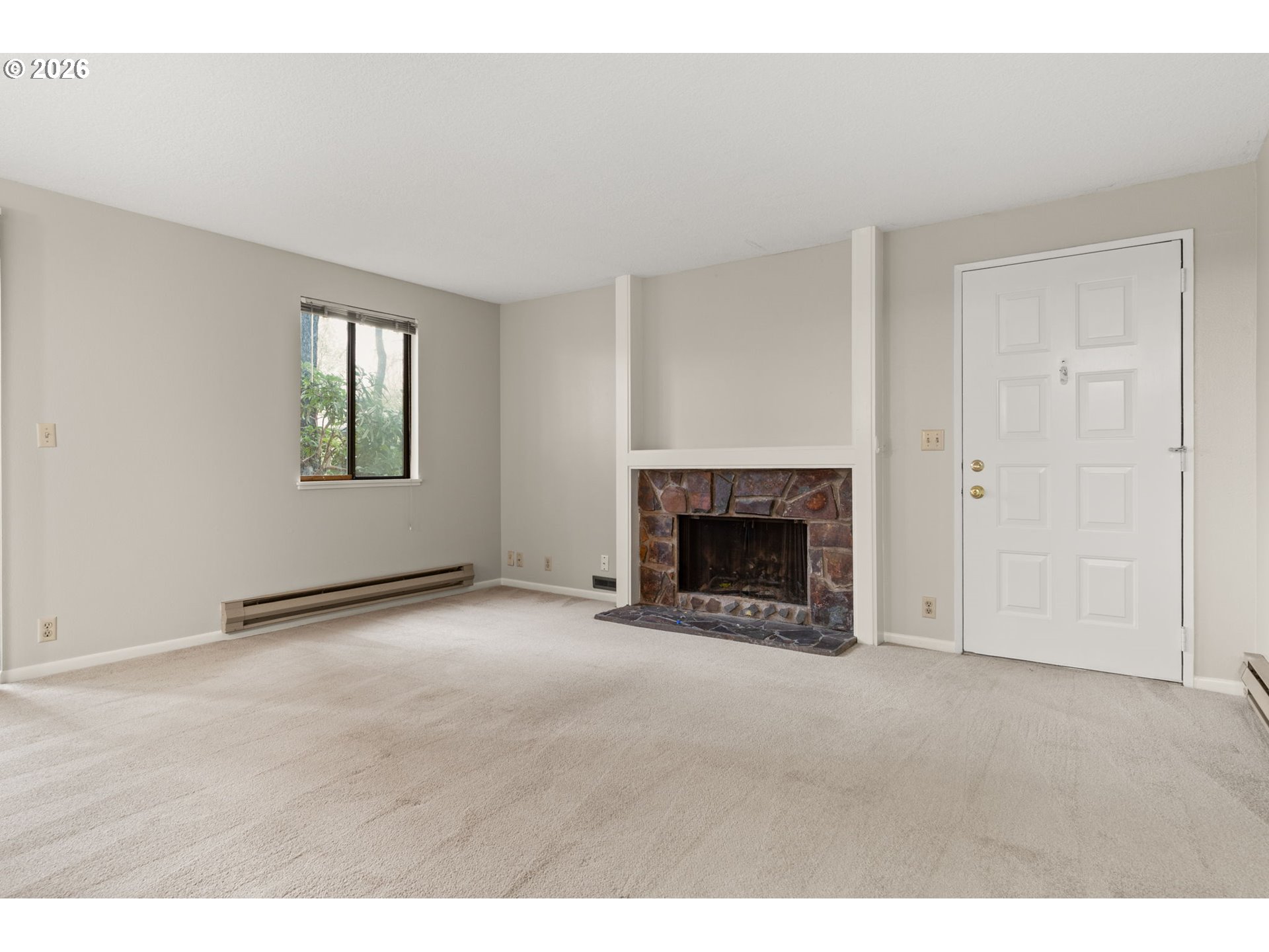 14720 Southwest Grayling Lane Beaverton, OR 97007 - Photo 4 of 32 a view of an empty room with a window