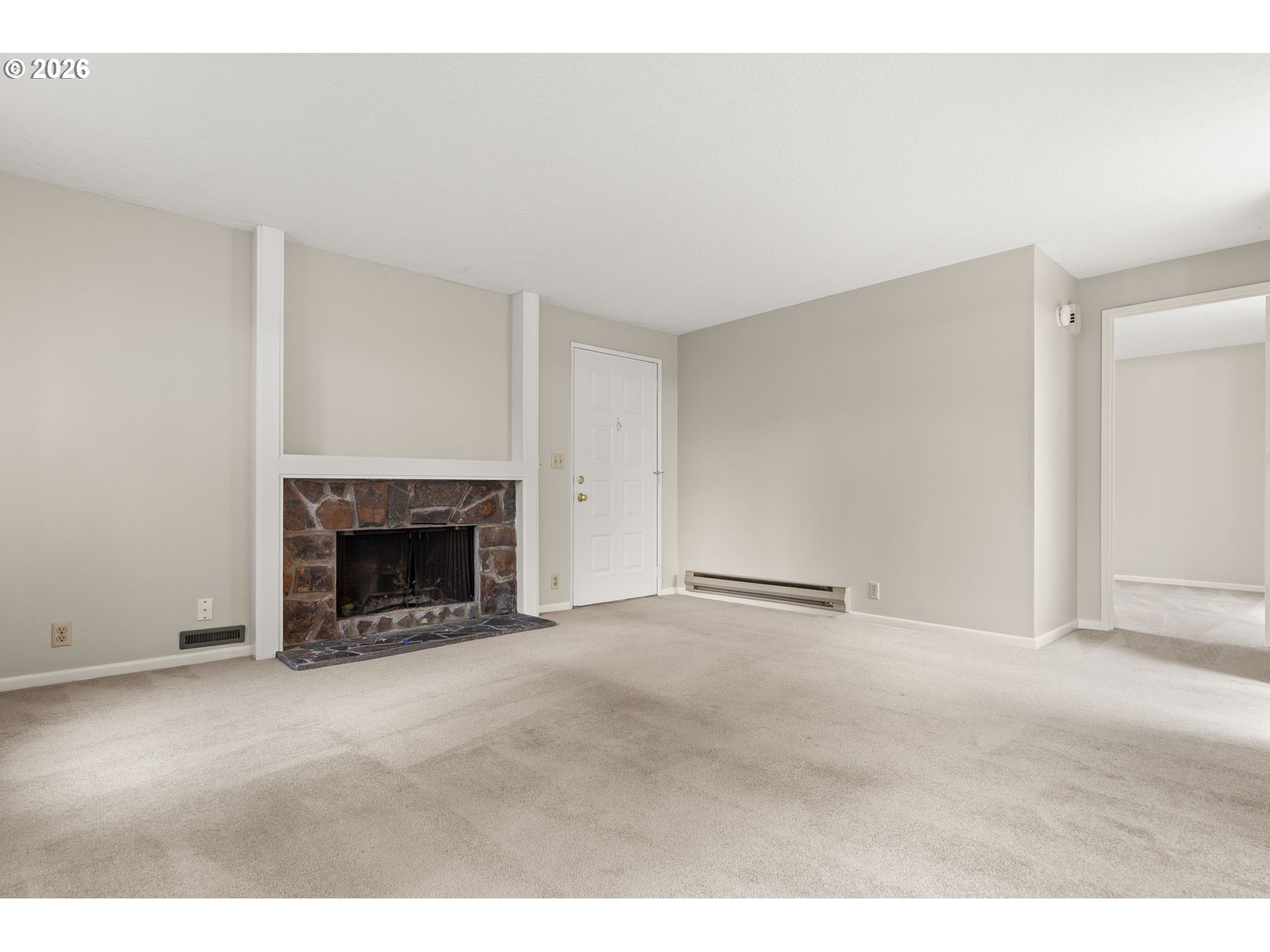 14720 Southwest Grayling Lane Beaverton, OR 97007 - Photo 5 of 32 a view of an empty room with a fireplace
