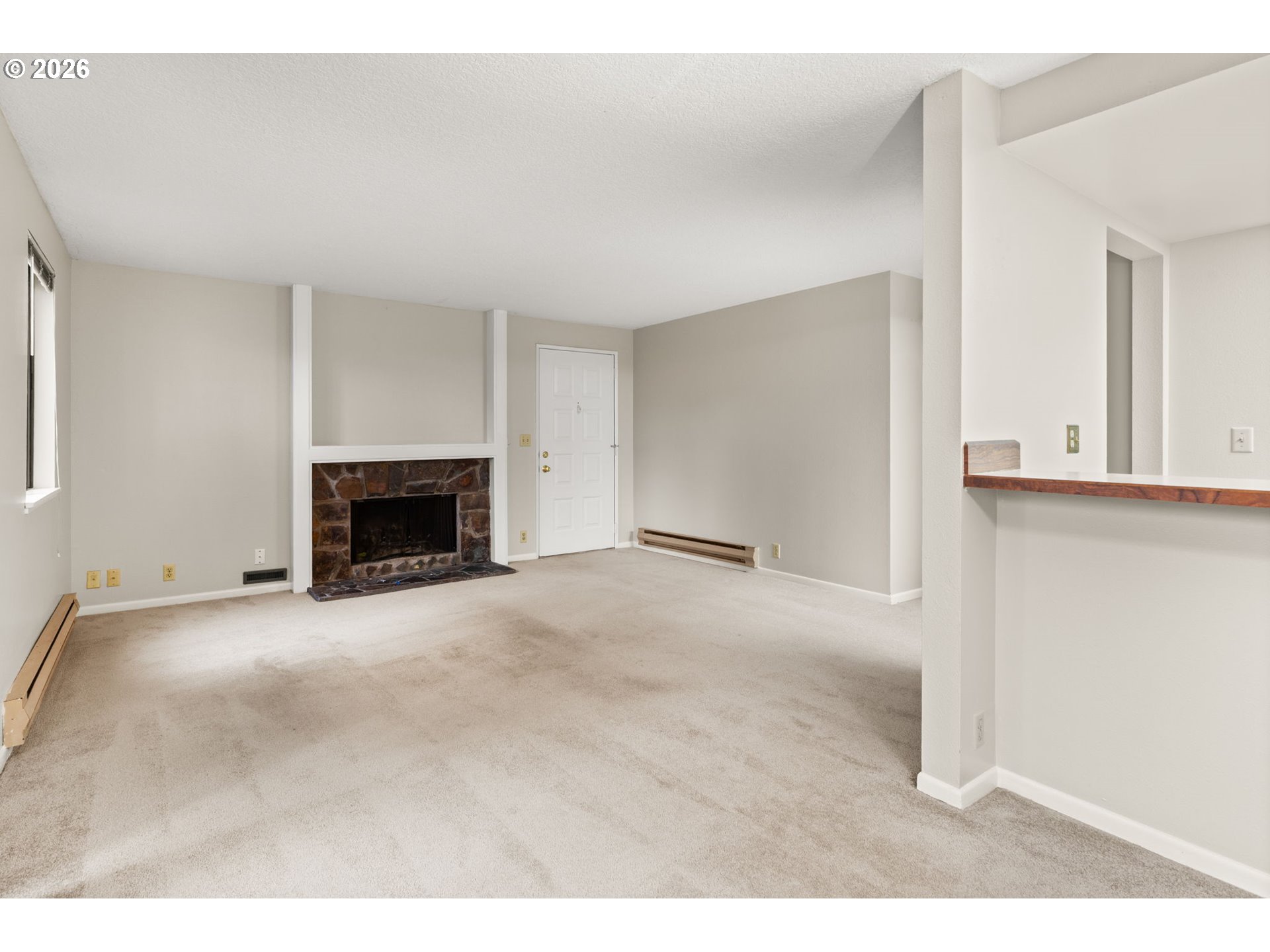 14720 Southwest Grayling Lane Beaverton, OR 97007 - Photo 6 of 32 a view of empty room with a fireplace