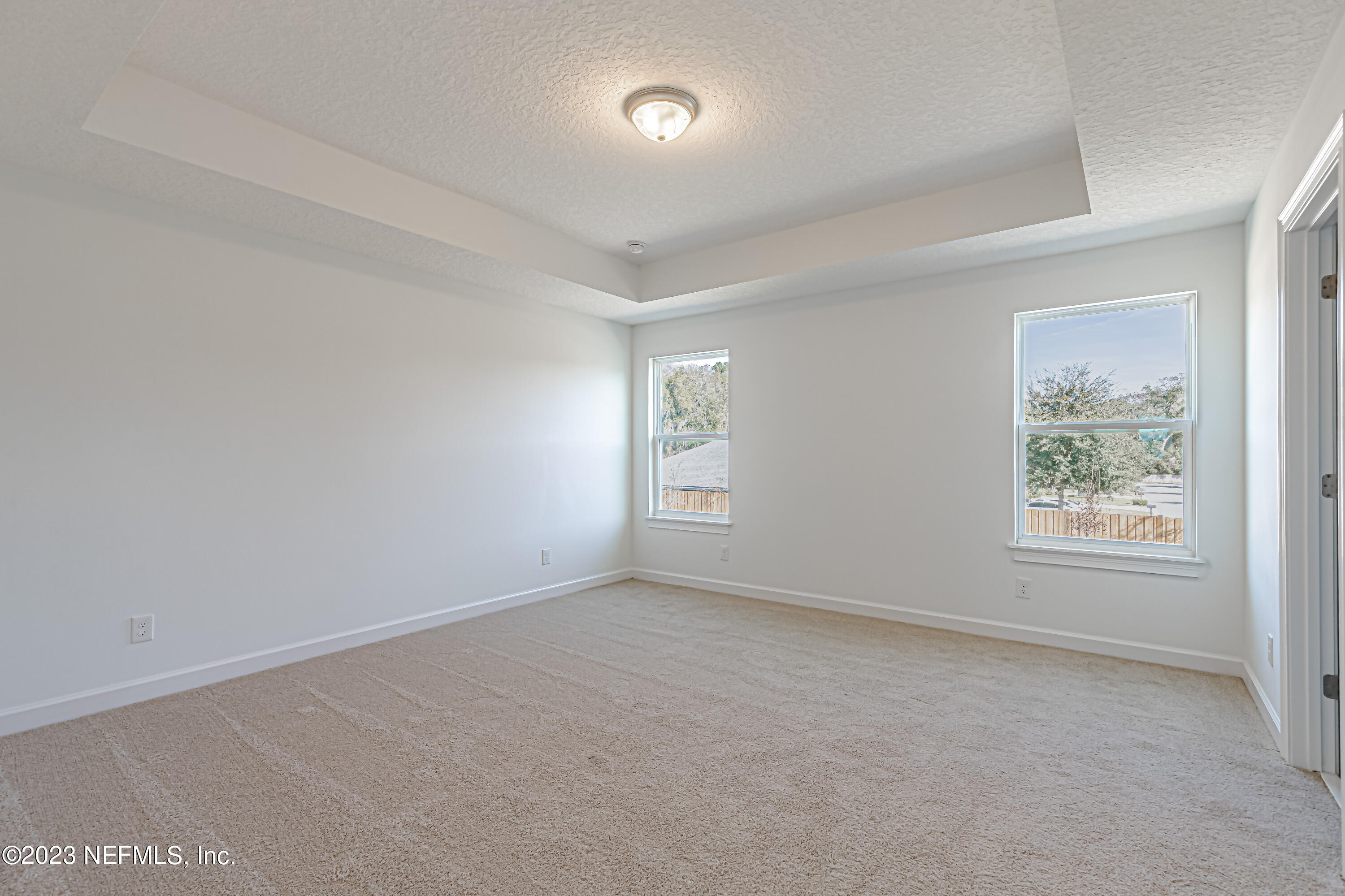 3057 Orange Picker Road Jacksonville, FL 32223 - Photo 12 of 21 an empty room with windows