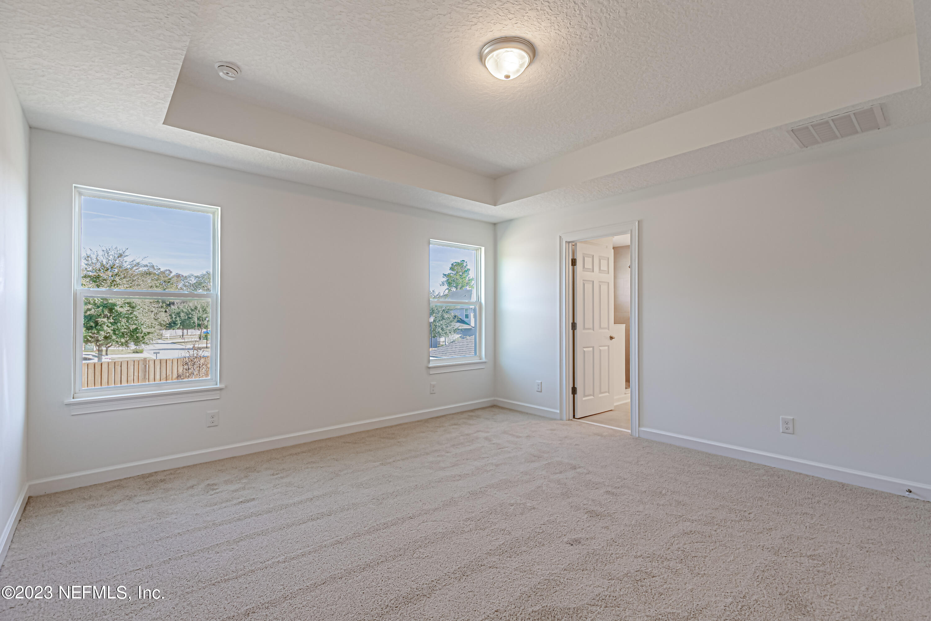 3057 Orange Picker Road Jacksonville, FL 32223 - Photo 13 of 21 an empty room with windows