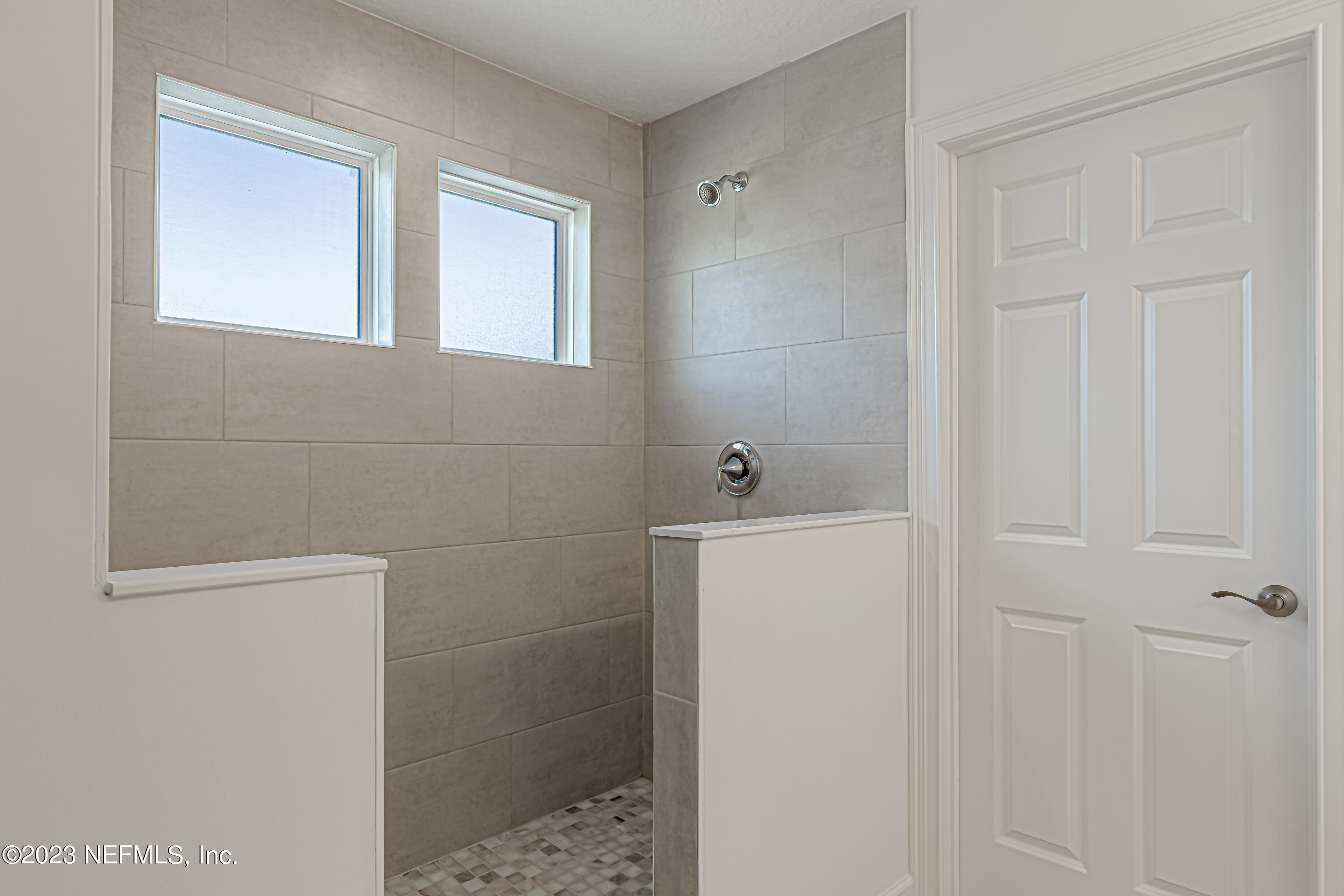 3057 Orange Picker Road Jacksonville, FL 32223 - Photo 16 of 21 a bathroom with a sink a toilet and shower