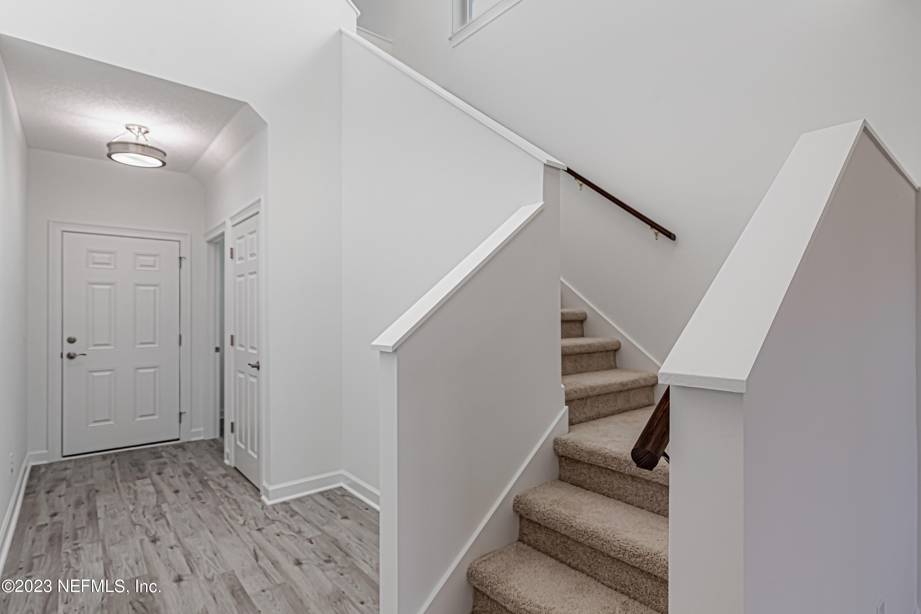 3057 Orange Picker Road Jacksonville, FL 32223 - Photo 3 of 21 a view of entryway with stairs and wooden floor