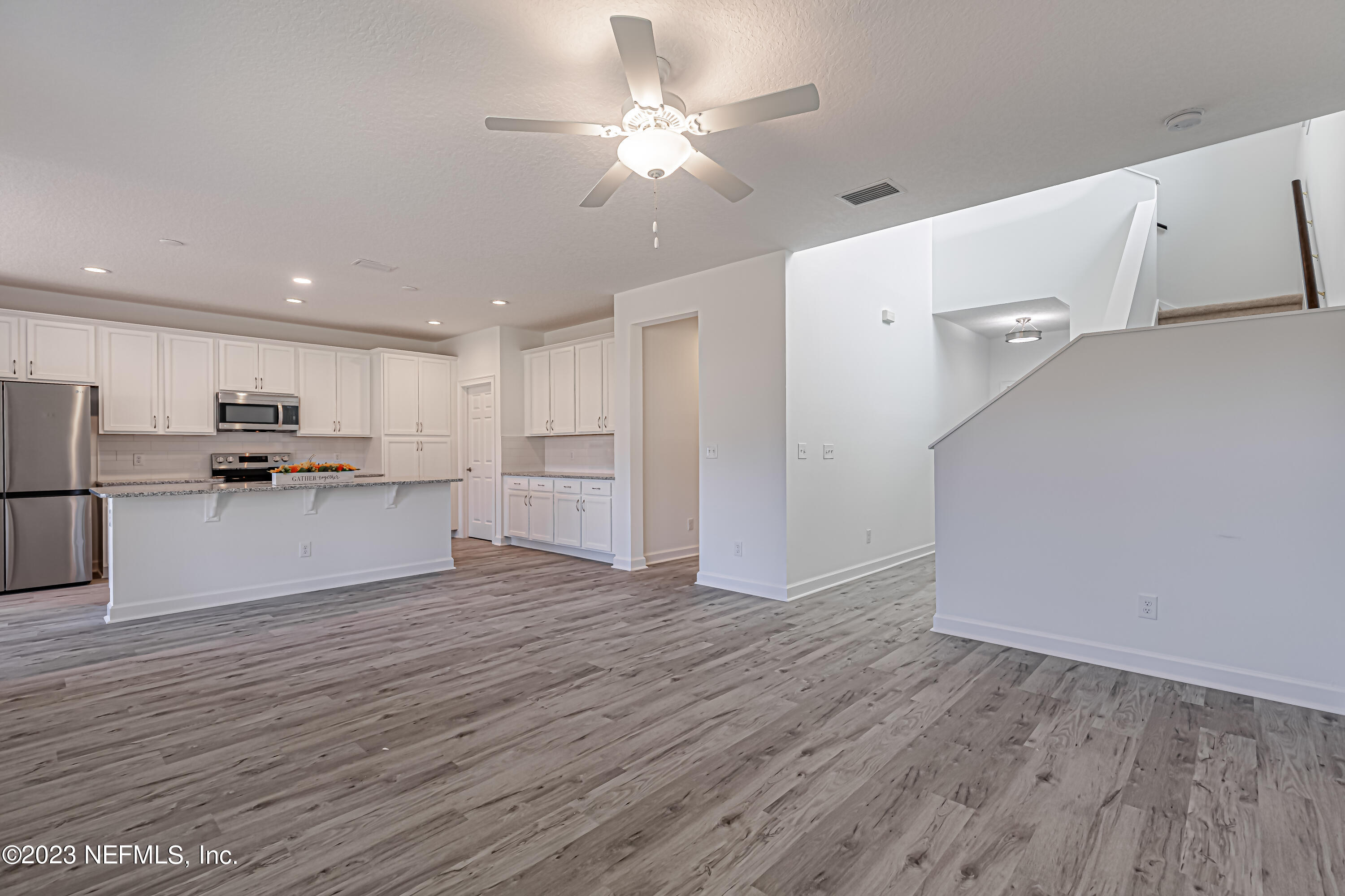 3057 Orange Picker Road Jacksonville, FL 32223 - Photo 5 of 21 a view of kitchen with wooden floor and electronic appliances