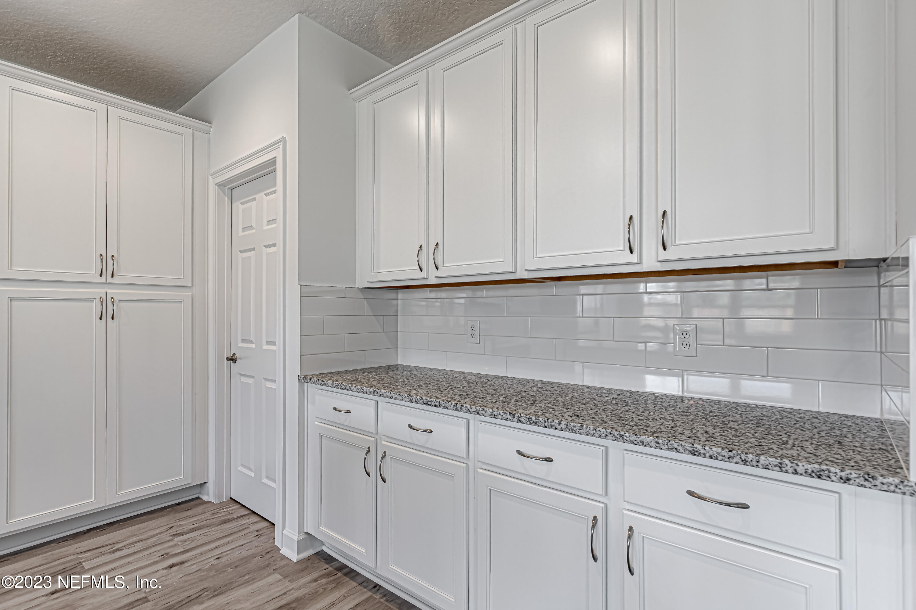3057 Orange Picker Road Jacksonville, FL 32223 - Photo 9 of 21 a kitchen with granite countertop white cabinets and sink