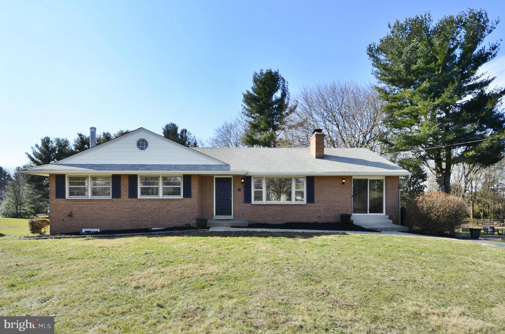 28608 Kemptown Road Damascus, MD 20872 - Photo 1 of 30 a front view of a house with a garden