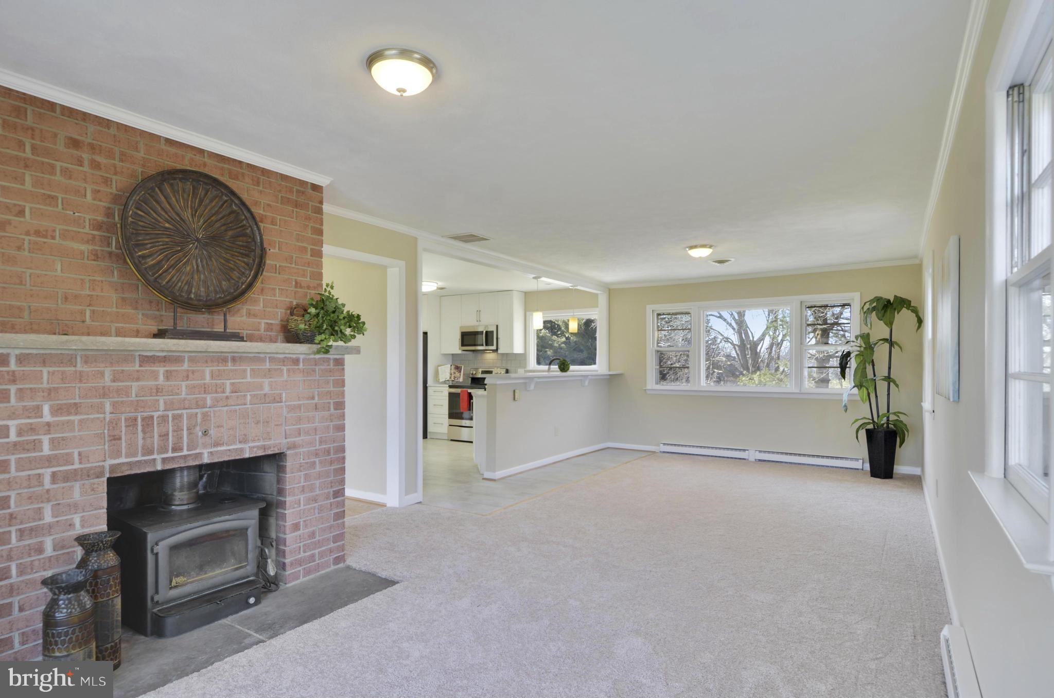 28608 Kemptown Road Damascus, MD 20872 - Photo 11 of 30 a view of a livingroom with furniture and a fireplace