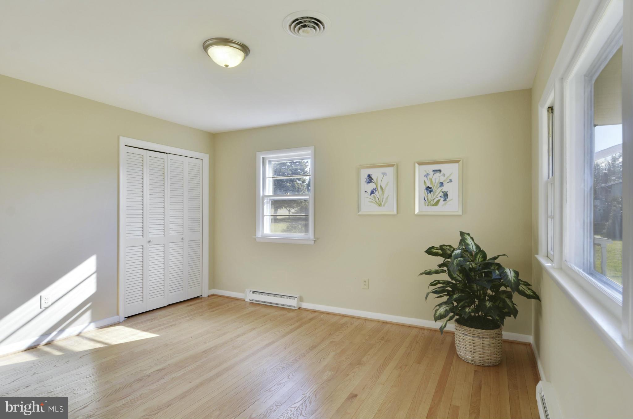 28608 Kemptown Road Damascus, MD 20872 - Photo 13 of 30 a view of a room with wooden floor and front door
