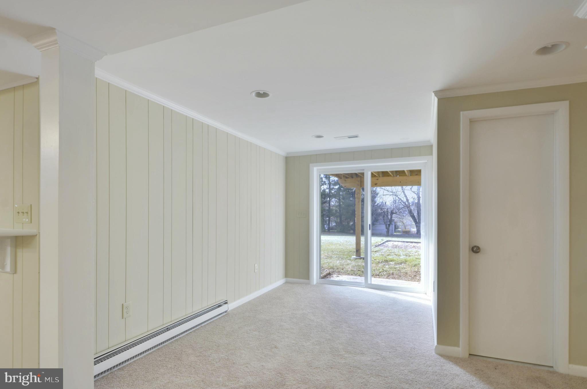 28608 Kemptown Road Damascus, MD 20872 - Photo 20 of 30 a view of a livingroom with an empty space and a window