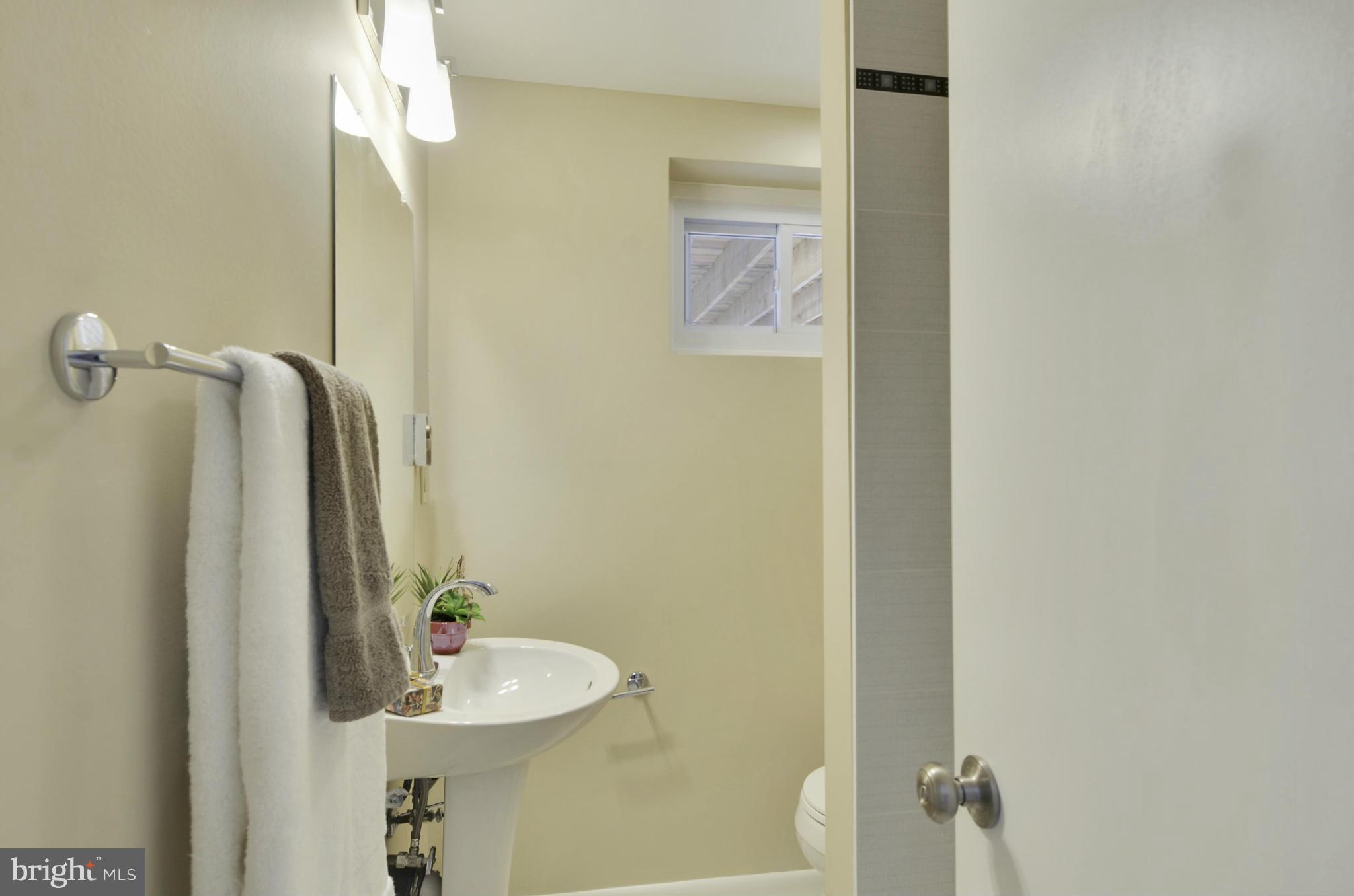28608 Kemptown Road Damascus, MD 20872 - Photo 23 of 30 a bathroom with a sink and mirror