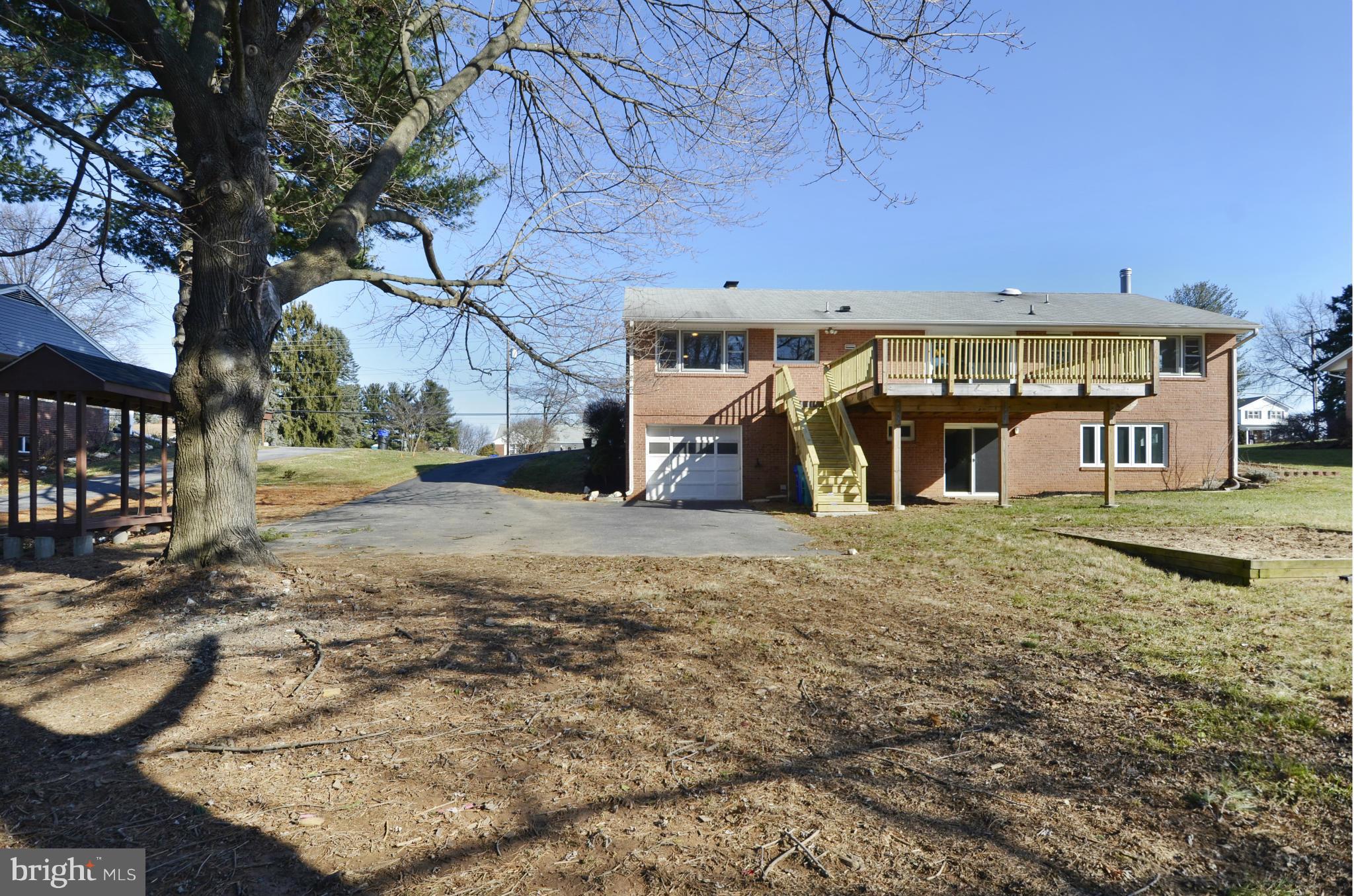 28608 Kemptown Road Damascus, MD 20872 - Photo 27 of 30 a front view of a house with garden
