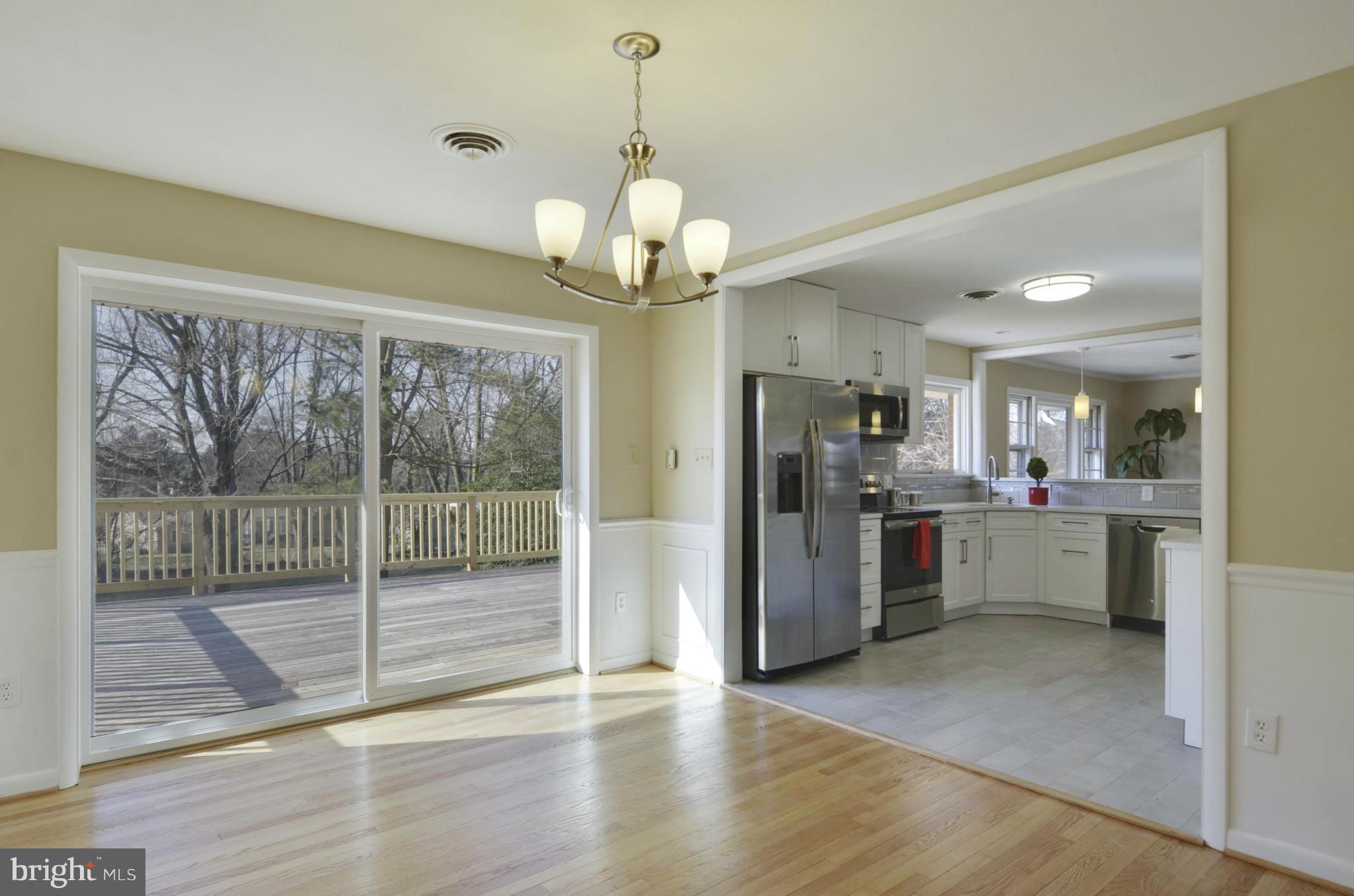 28608 Kemptown Road Damascus, MD 20872 - Photo 5 of 30 a view of a kitchen with refrigerator and microwave