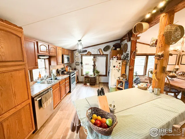 a large white room with a large window and chairs