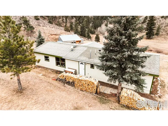 a aerial view of a house with a yard