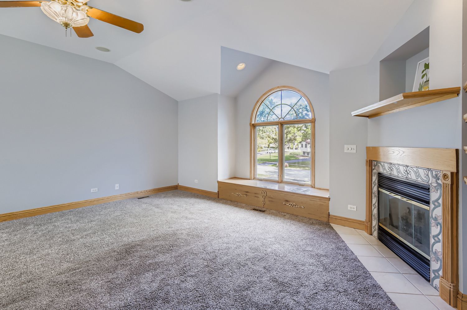 5904 Elm Street Lisle, IL 60532 - Photo 14 of 36 a view of an empty room with a window and fireplace