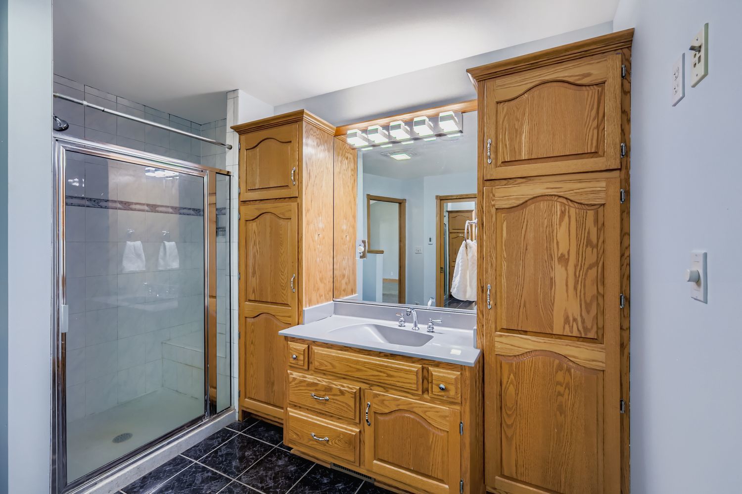 5904 Elm Street Lisle, IL 60532 - Photo 17 of 36 a bathroom with a granite countertop sink mirror and shower