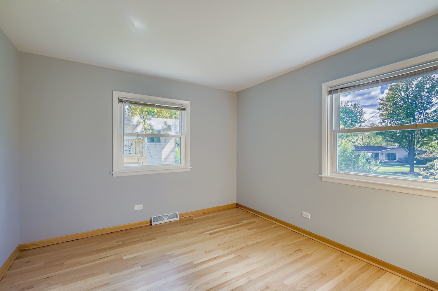 5904 Elm Street Lisle, IL 60532 - Photo 20 of 36 a view of an empty room with wooden floor and a window
