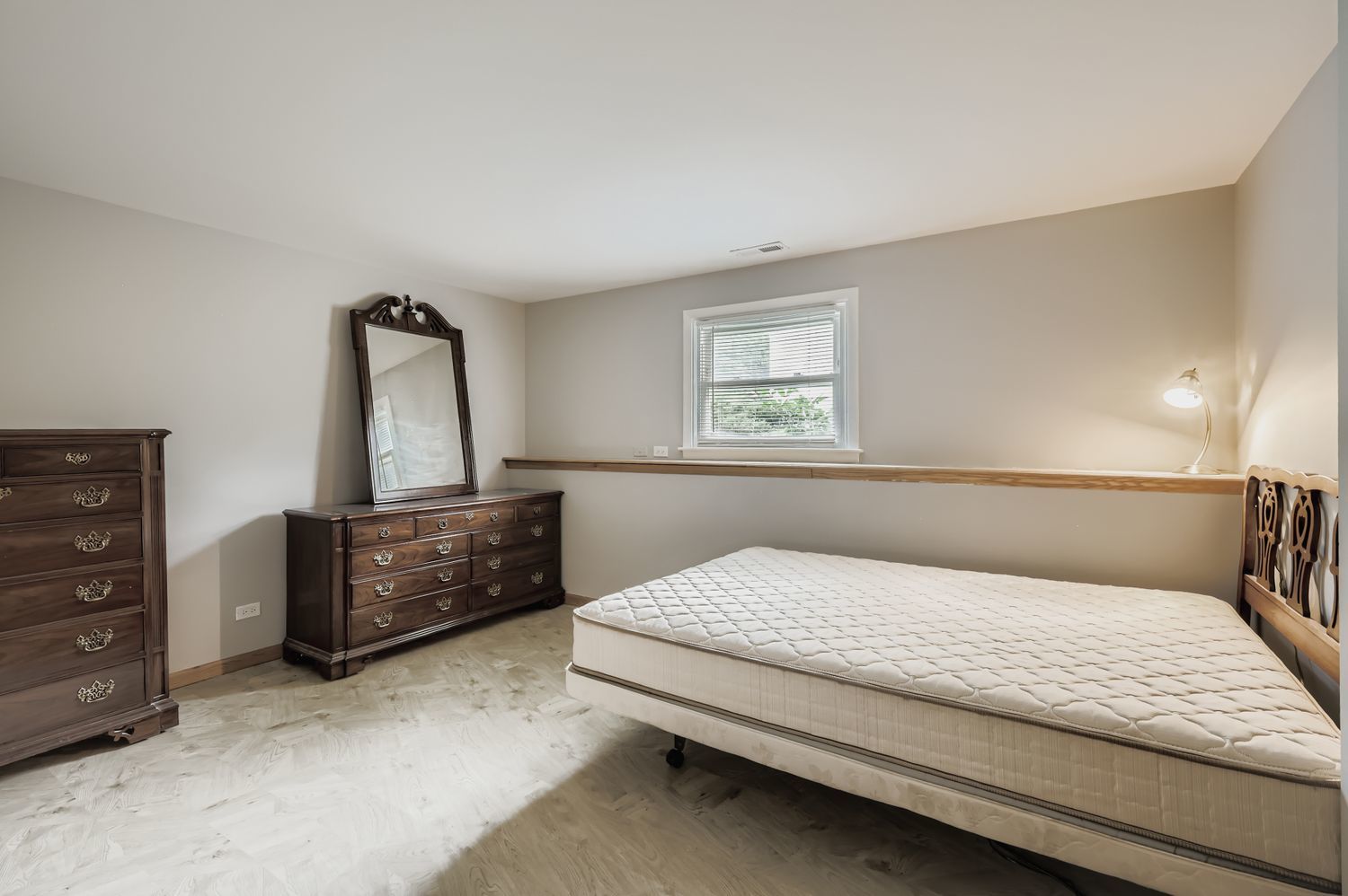 5904 Elm Street Lisle, IL 60532 - Photo 24 of 36 a bedroom with a large bed and a dresser