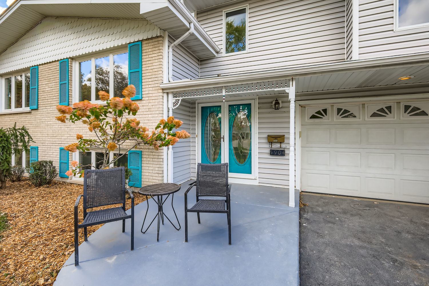 5904 Elm Street Lisle, IL 60532 - Photo 3 of 36 a view of a patio with table and chairs and potted plants