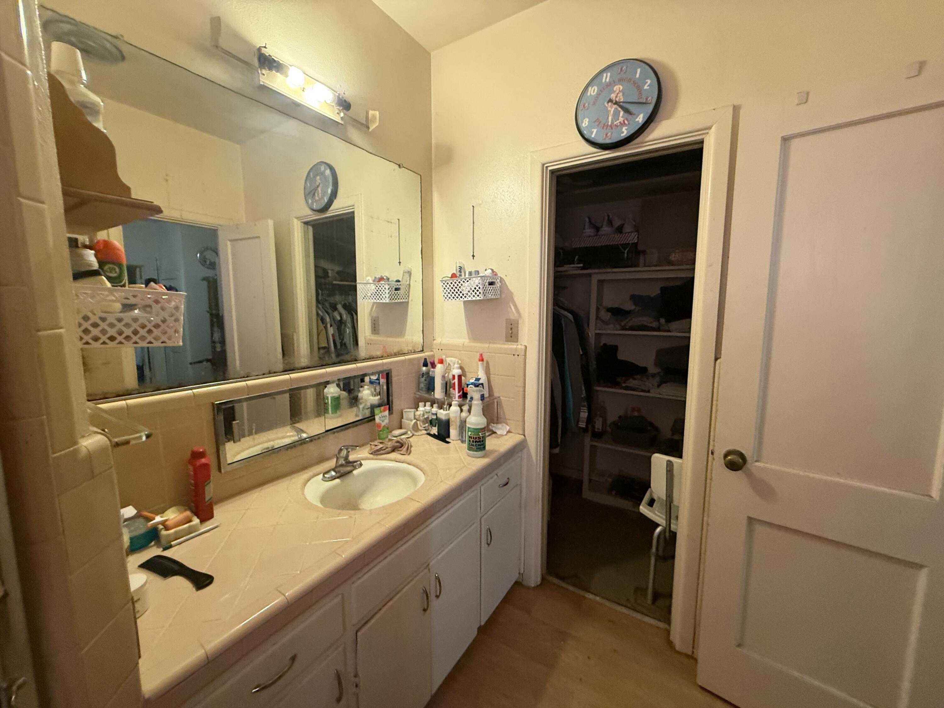 Package Package Property Lubbock, TX 79411 - Photo 37 of 71 a bathroom with a sink a vanity and a mirror