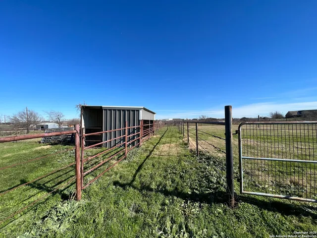 a view of a back yard from a balcony