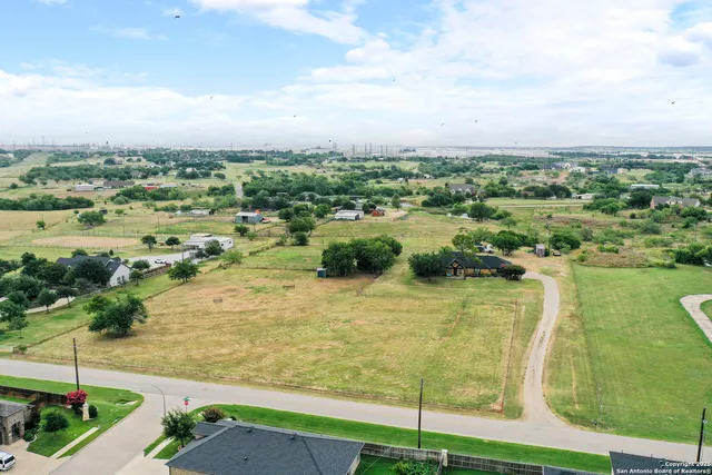 a view of a lake with a yard