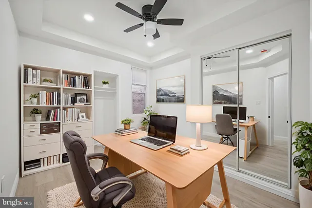 a view of a workspace with furniture