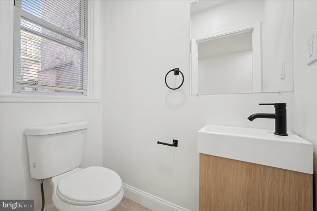 a bathroom with a toilet and a sink