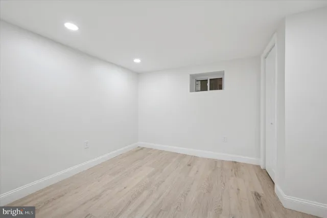 a view of a room with wooden floor and natural light