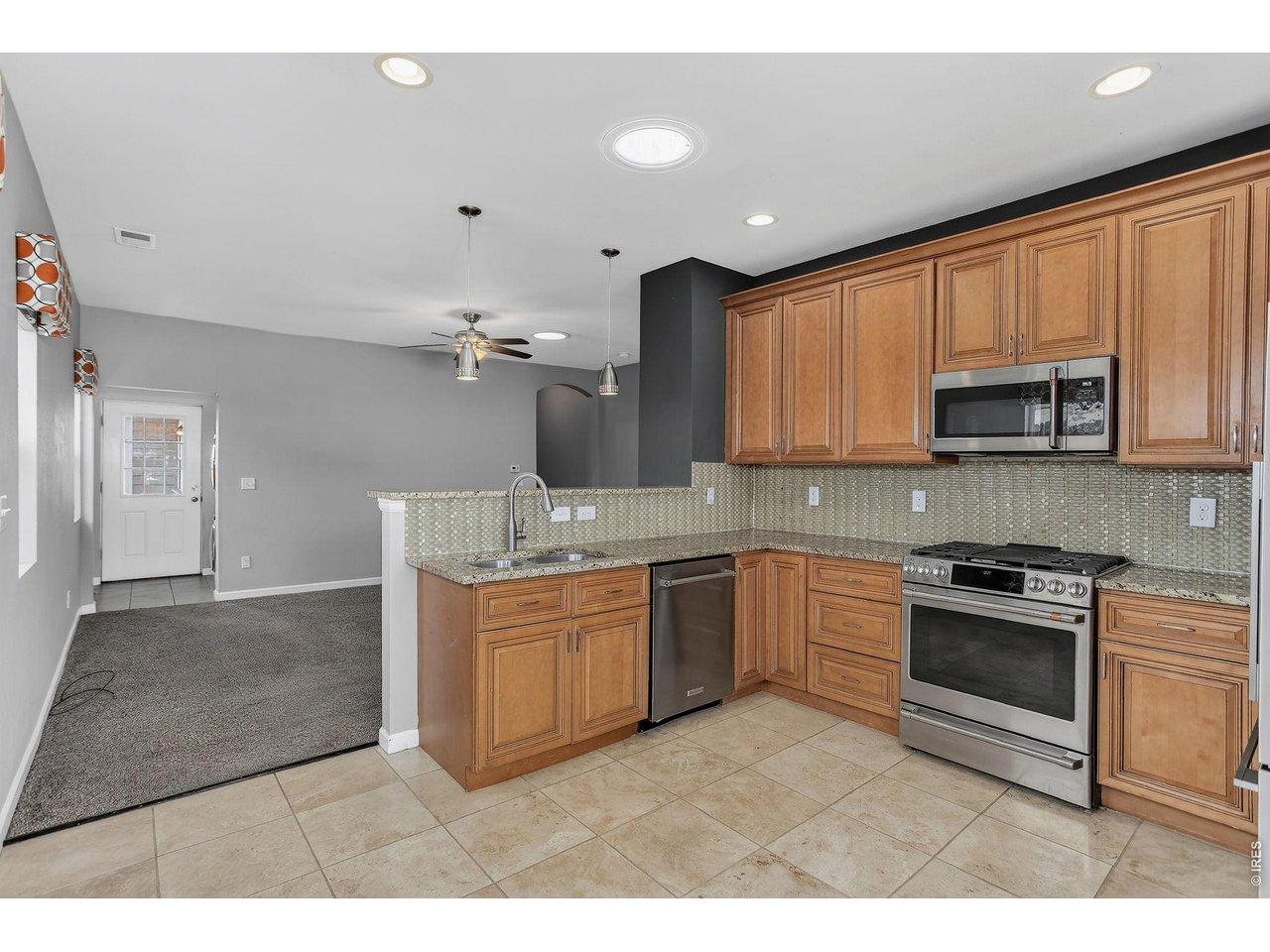 326 South Raleigh Street Denver, CO 80219 - Photo 5 of 17 Kitchen-looking into living room and to backyard door