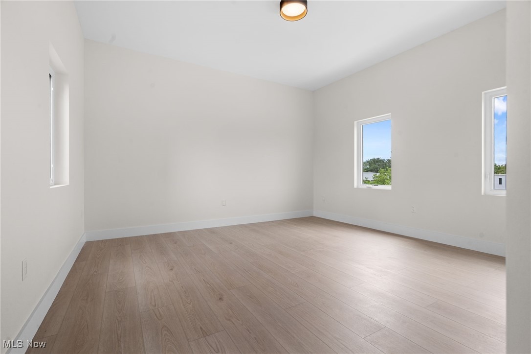 2155 Columbus Road Cleveland, OH 44113 - Photo 30 of 50 Empty room with wood finished floors and baseboards