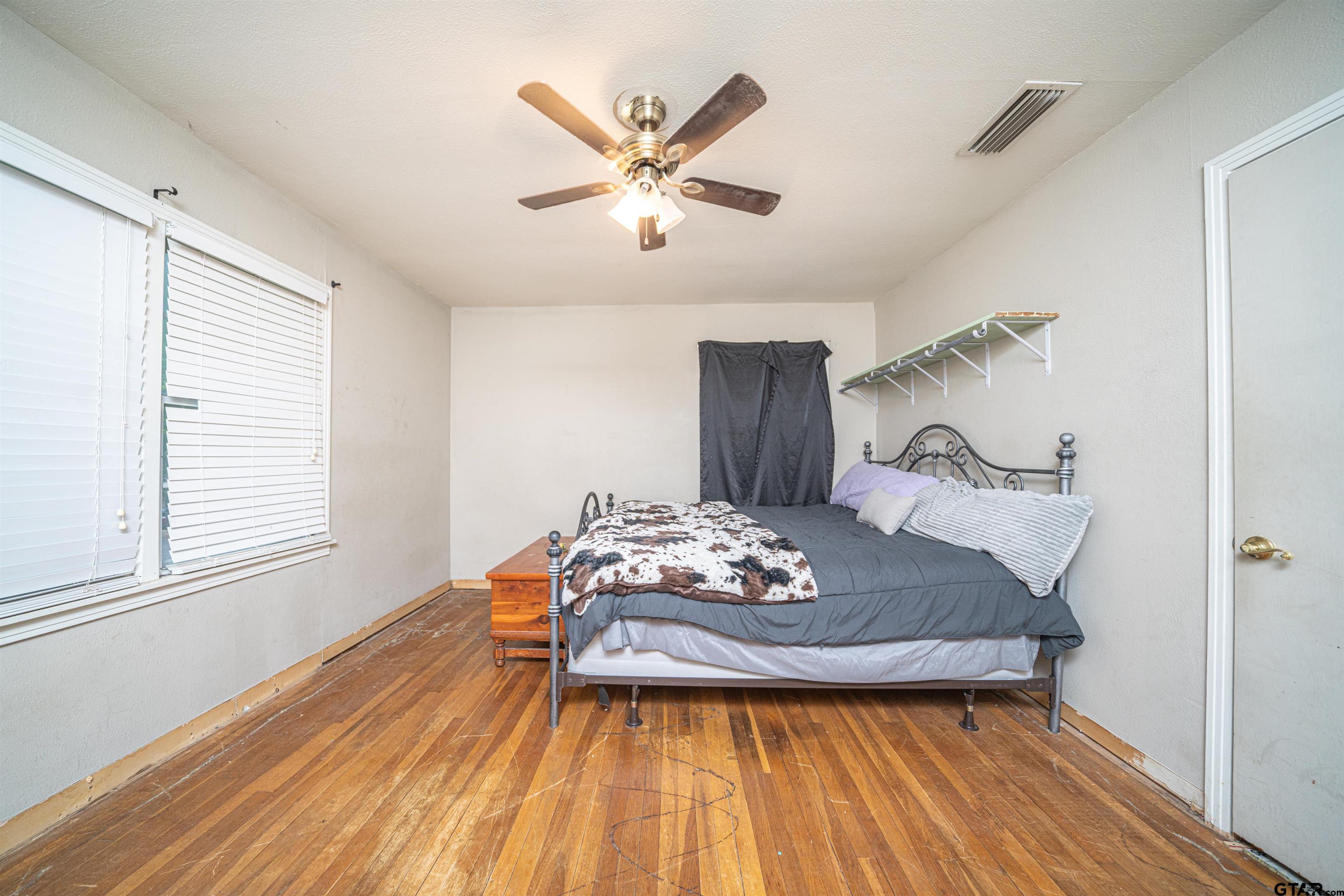 206 Summit Drive Gilmer, TX 75644 - Photo 12 of 24 a view of a livingroom with furniture and wooden floor