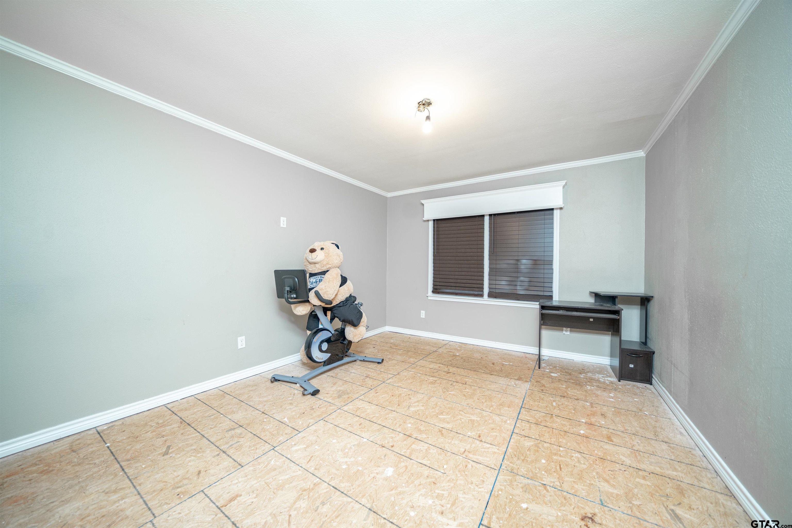206 Summit Drive Gilmer, TX 75644 - Photo 14 of 24 a view of a room with a bench and couch