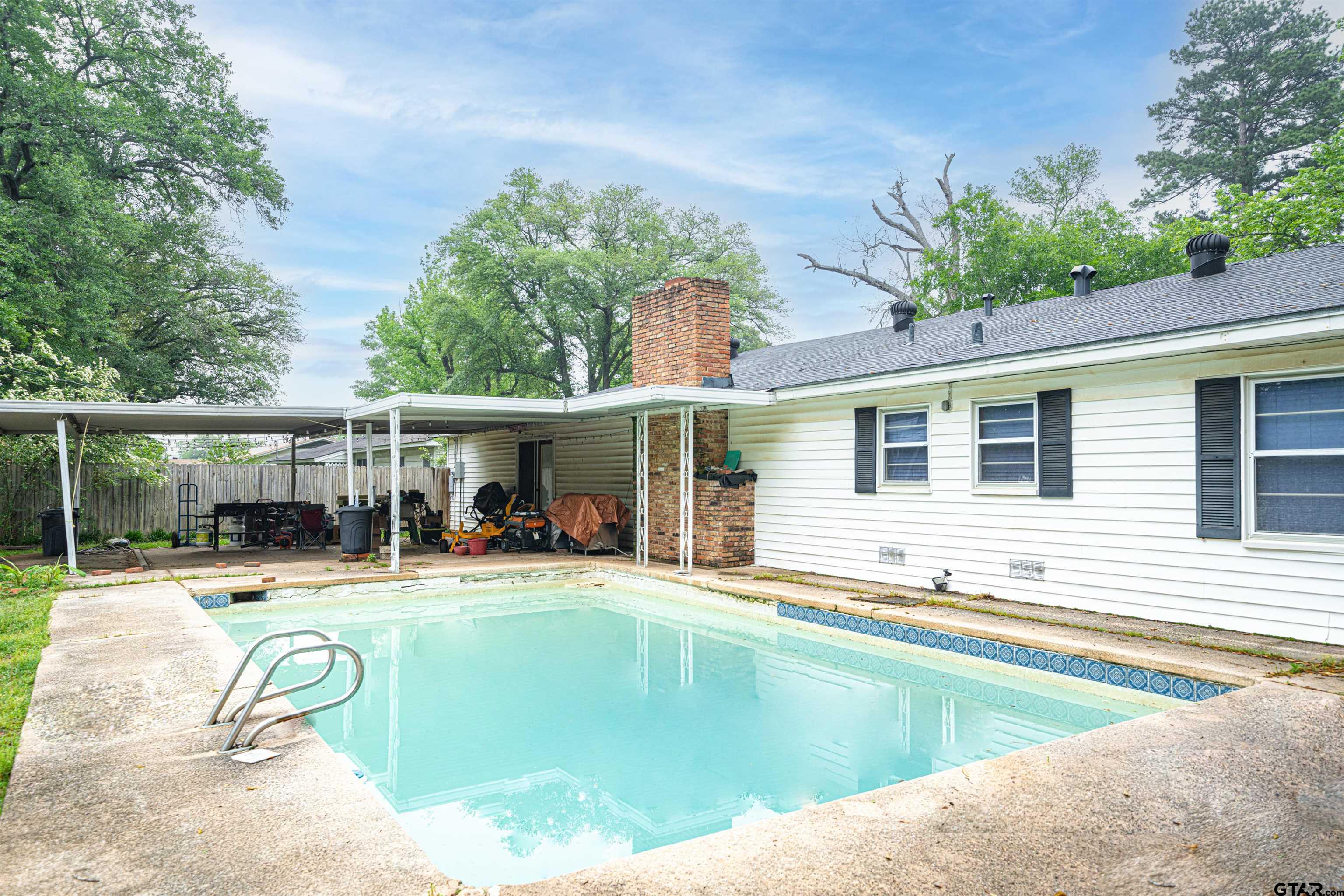 206 Summit Drive Gilmer, TX 75644 - Photo 17 of 24 a view of a swimming pool with a patio