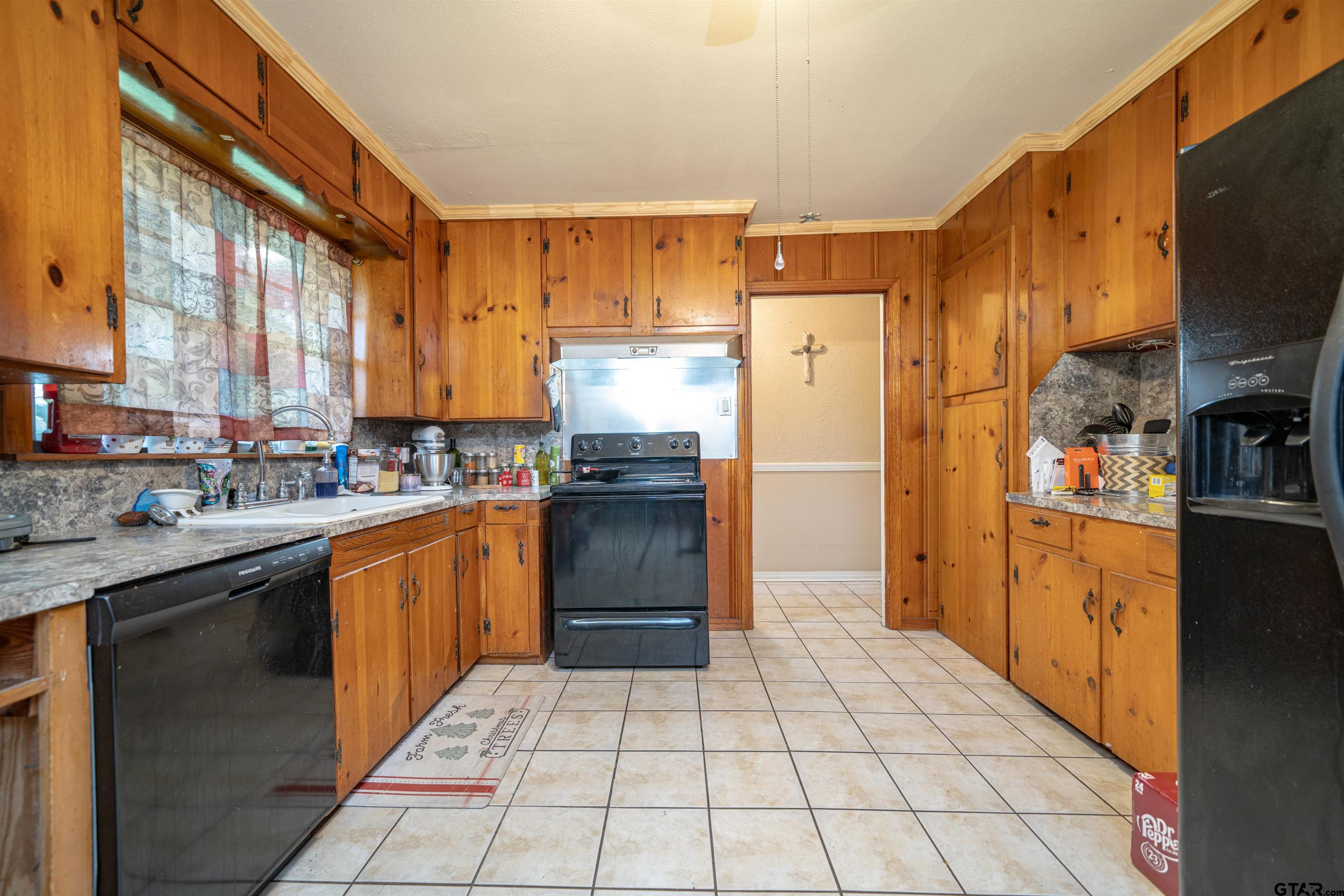 206 Summit Drive Gilmer, TX 75644 - Photo 2 of 24 a kitchen with stainless steel appliances granite countertop a refrigerator and a sink