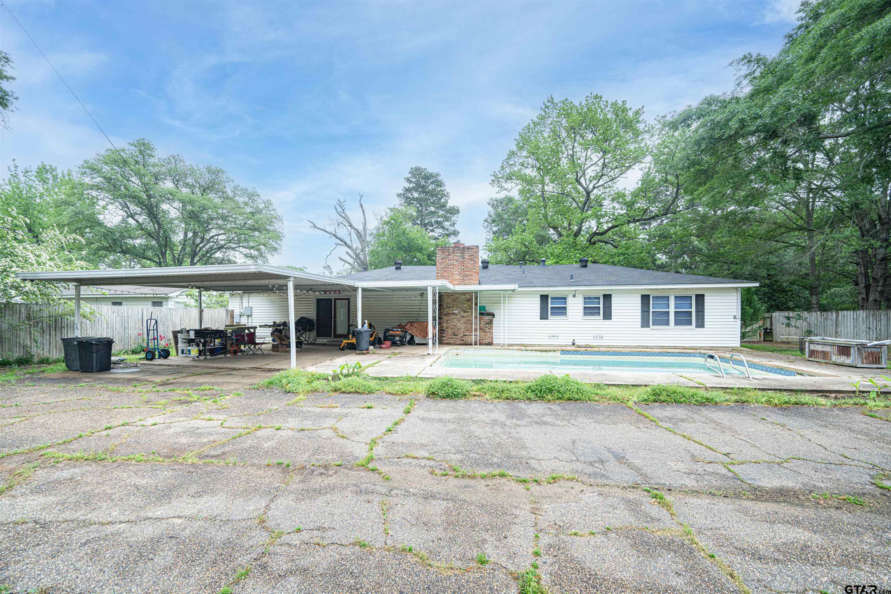 206 Summit Drive Gilmer, TX 75644 - Photo 22 of 24 a view of house with outdoor space and swimming pool