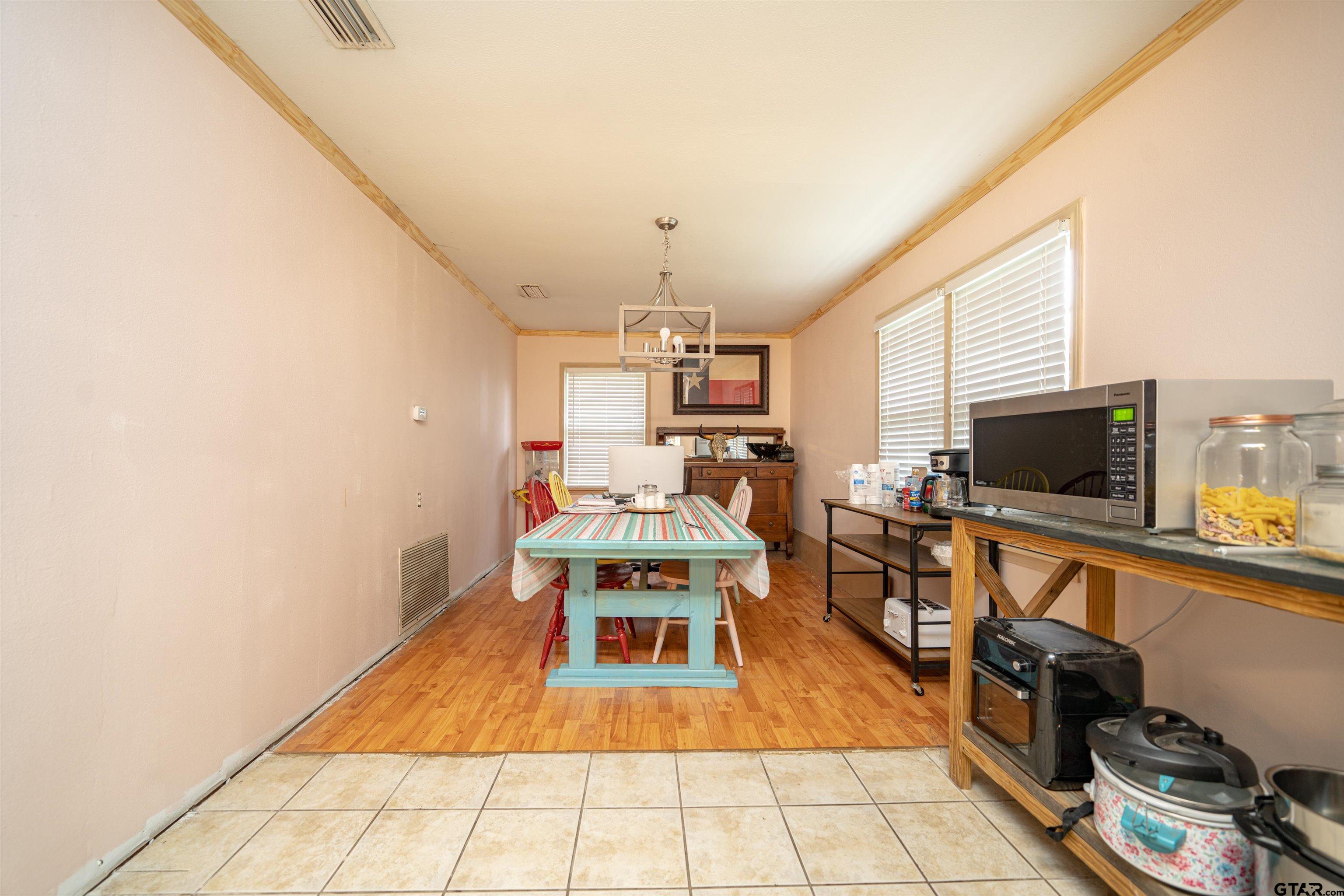 206 Summit Drive Gilmer, TX 75644 - Photo 4 of 24 a living room with a couch and a flat screen tv
